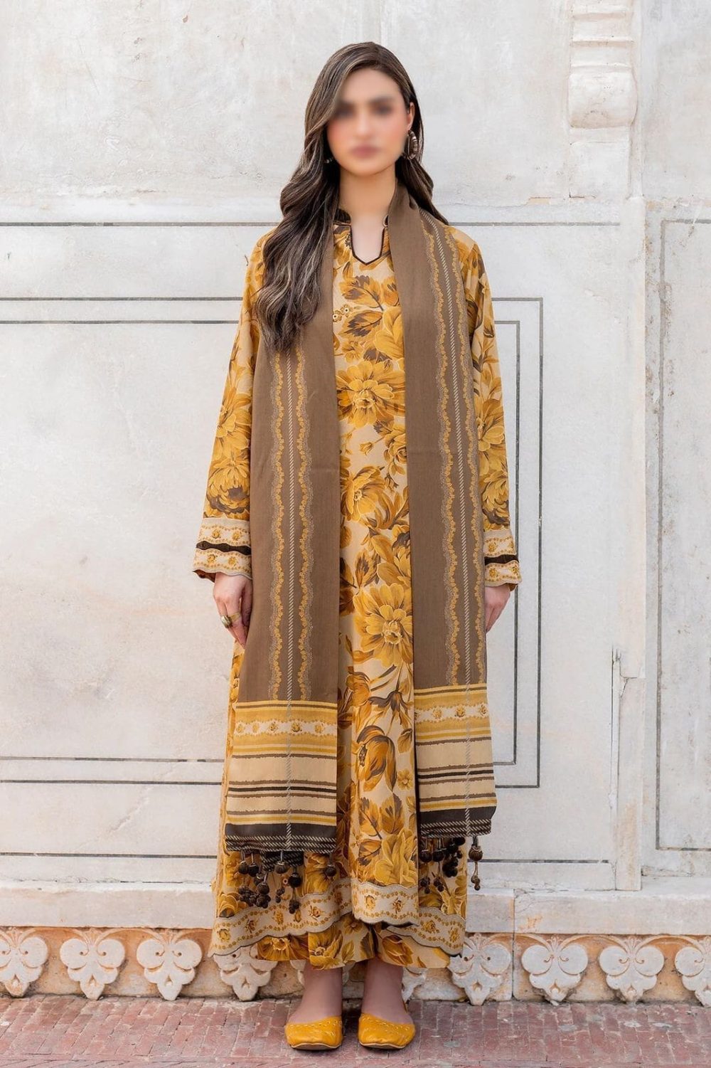 Model wearing mustard-beige Baroque embroidered suit with brown dupatta and ethnic