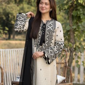 Elegant embroidered cambric cotton suit paired with a heavy chiffon dupatta – detailed neckline and soft fabric texture displayed