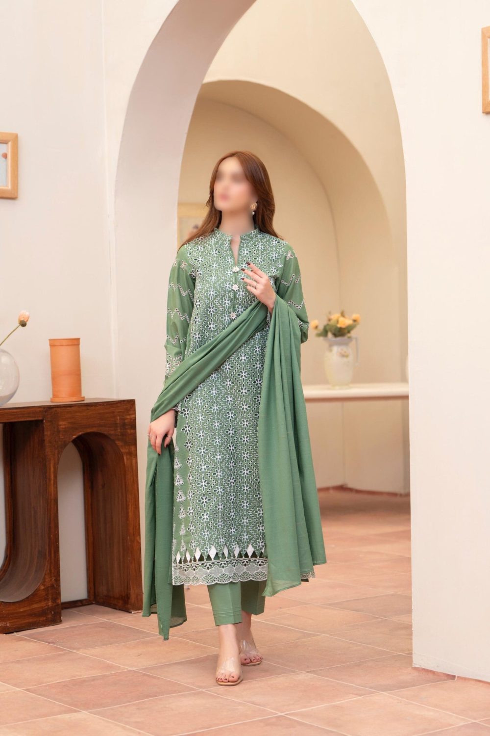 Merakhi 3PC lawn Chickenkari suit with laser-cut embroidery, embroidered sleeves, and green slub dupatta