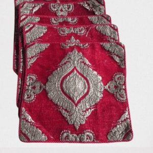 Set of 5 red cushion covers neatly arranged for sofa or bed décor
