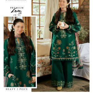 Model wearing Coco by Zara Shahjahan bottle green embroidered lawn suit paired with a floral printed dupatta, styled in a cozy indoor setting.