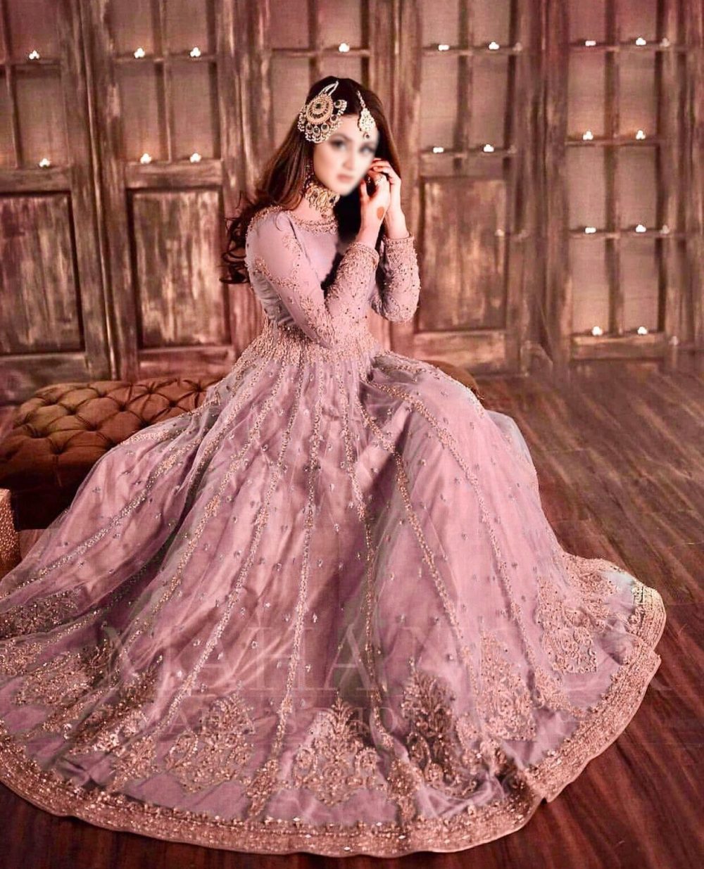 Model wearing Hira Mani blush net frock with heavy embroidery and mirror work – front view