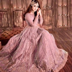 Model wearing Hira Mani blush net frock with heavy embroidery and mirror work – front view