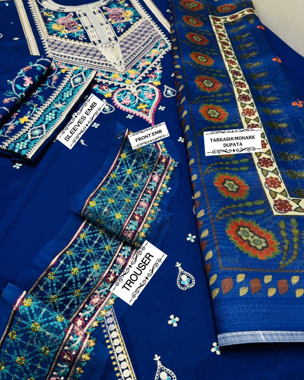 Flat lay of COCO by Zara.J blue embroidered 3pc lawn suit with front, sleeves embroidery and Tarkashi Monark dupatta
