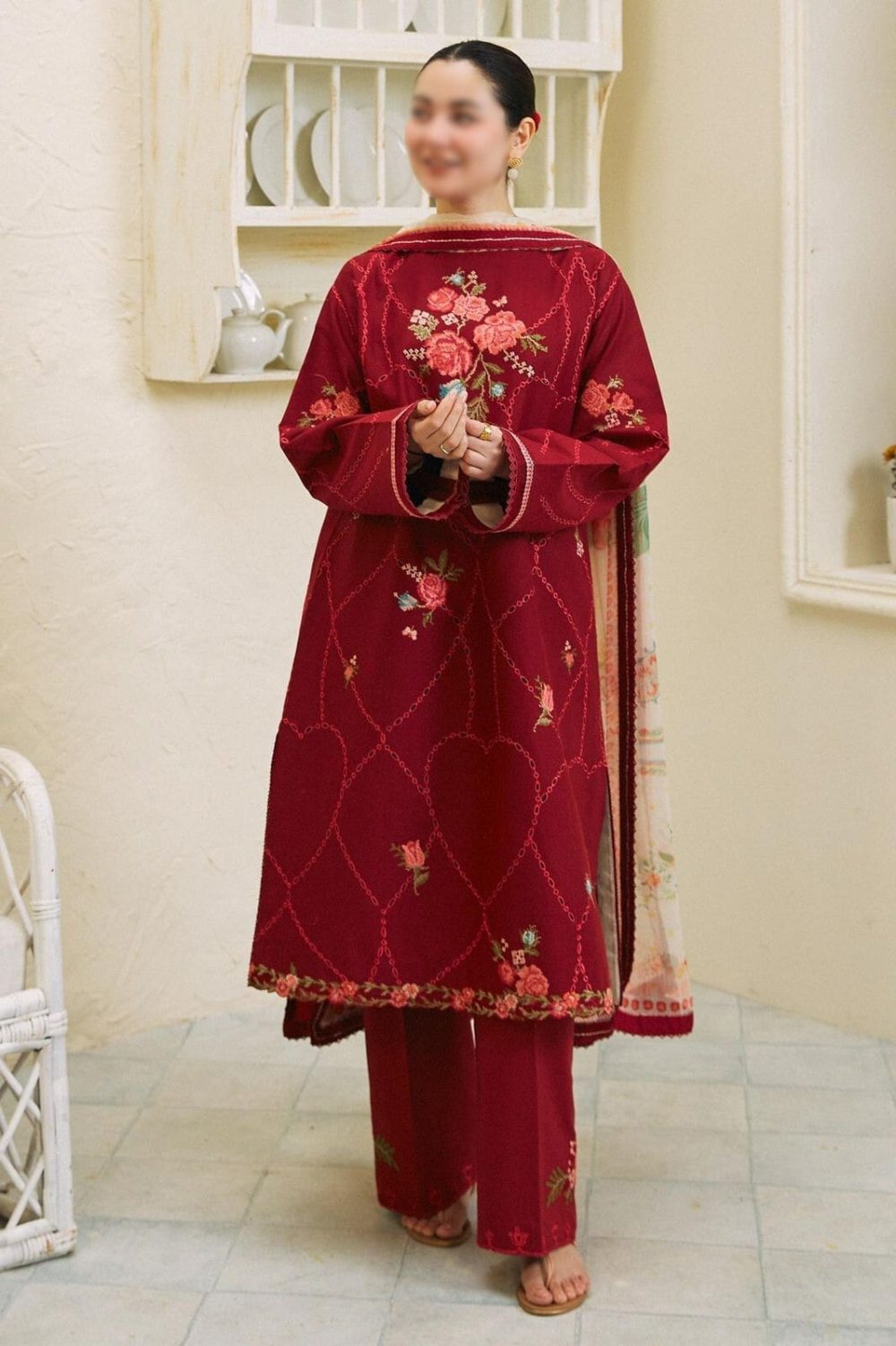 Model wearing COCO by Zara.J crimson red embroidered lawn suit with floral detailing and Tarkashi dupatta – Summer 2025
