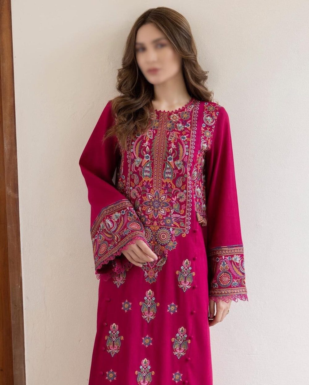 Front view of model holding unstitched red 2 piece airjet lawn red suit for summer