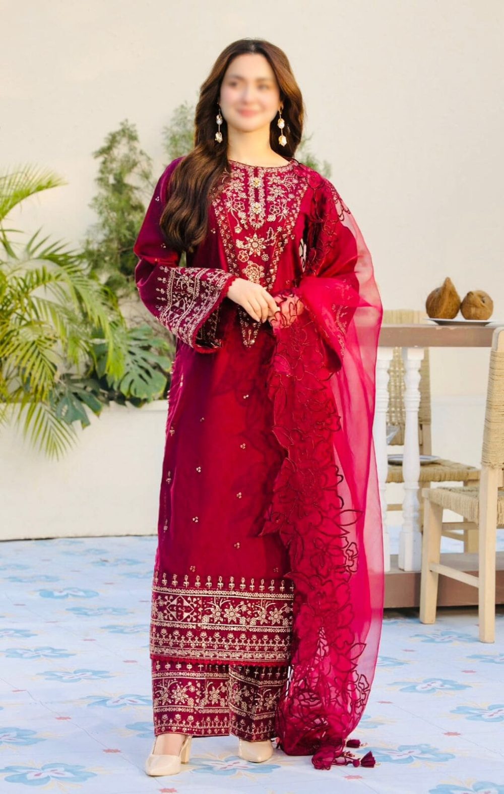 Model wearing Qalamkar red embroidered 3-piece lawn suit with khaadi net dupatta – Summer Casual Collection 2025