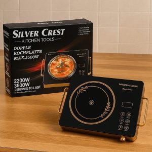 Silver Crest Infrared Cooker 3500W with Gold Handles and Black Crystal Plate on Wooden Table
