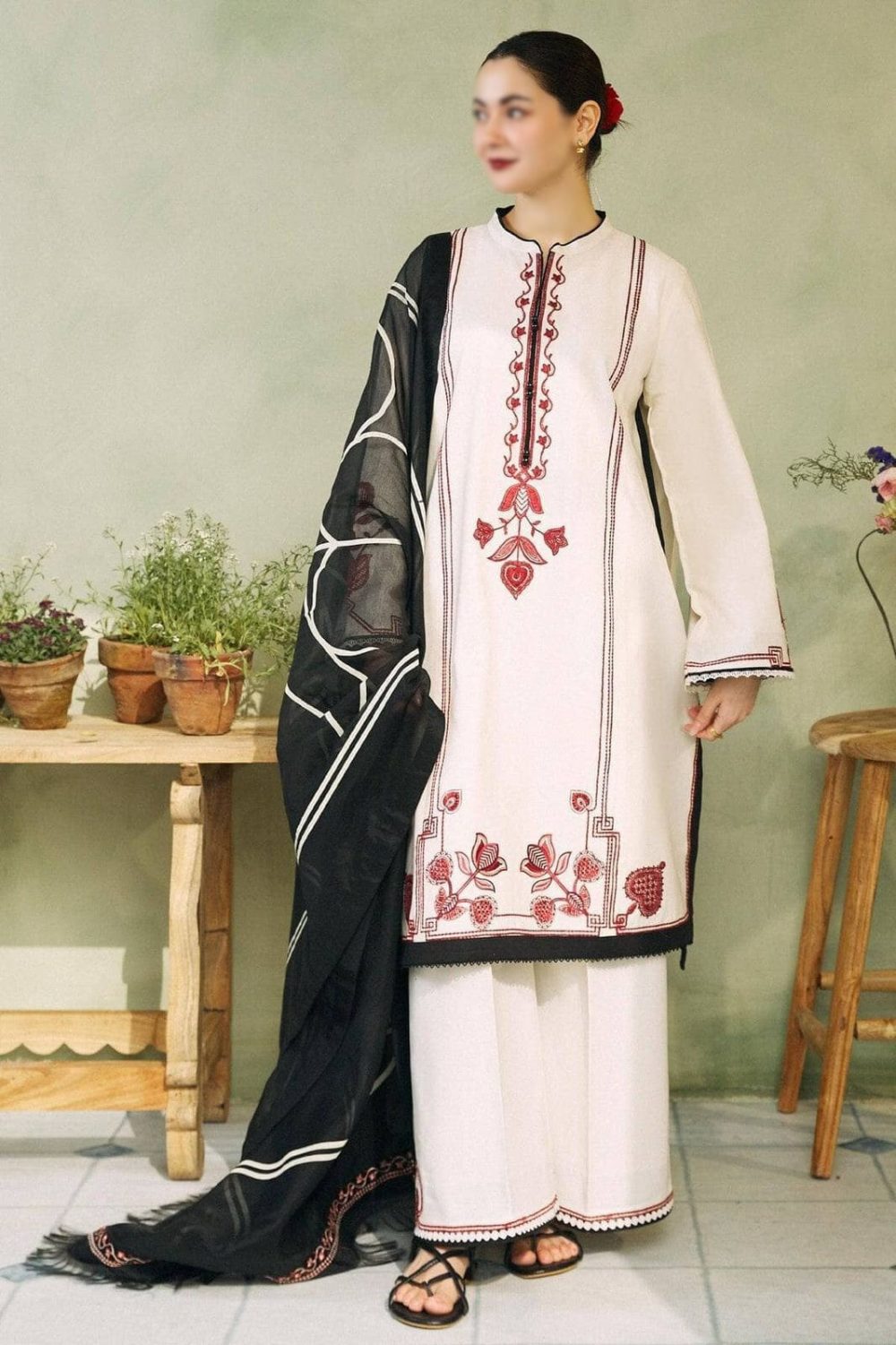 Model wearing Zara Shahjahan white embroidered lawn suit with black Tarkashi dupatta – front full view.